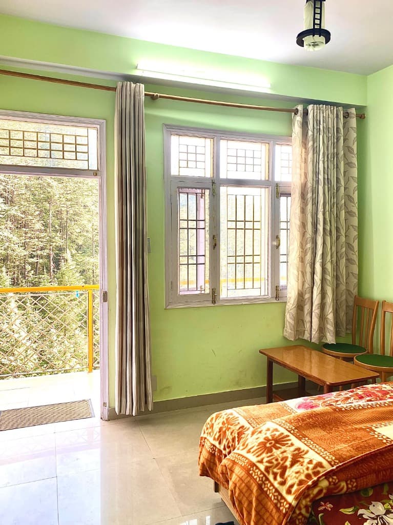 Cozy Bedroom with Balcony View