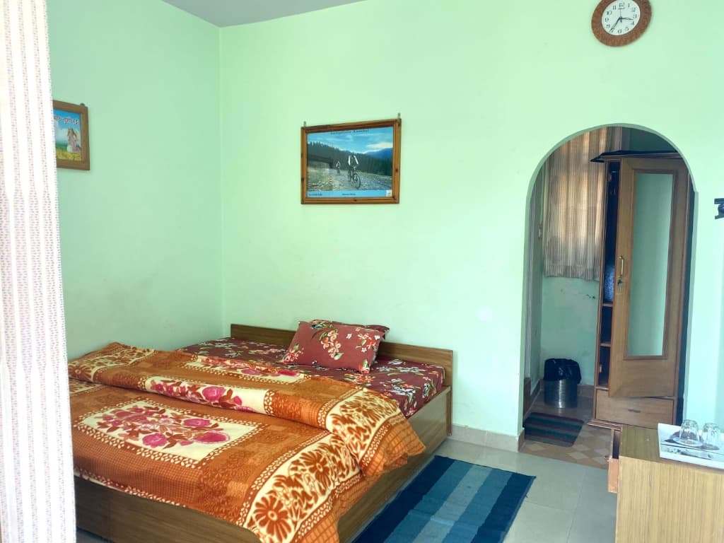 Valley View Room interior and Himalayan view 2 at Dev Homestay Shimla