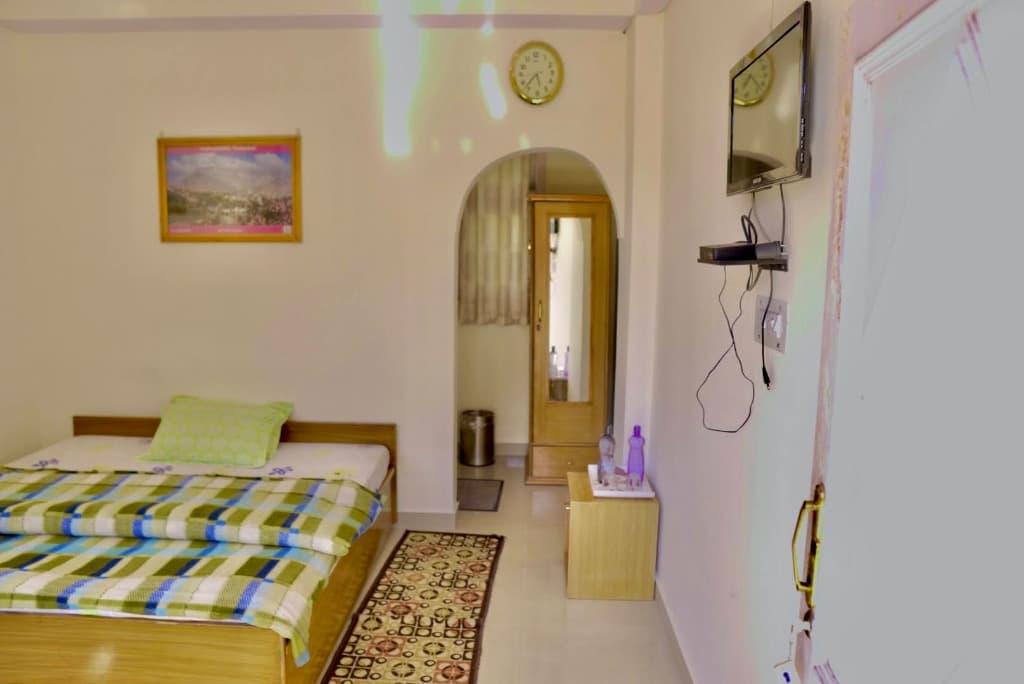 Valley View Room interior and Himalayan view 1 at Dev Homestay Shimla