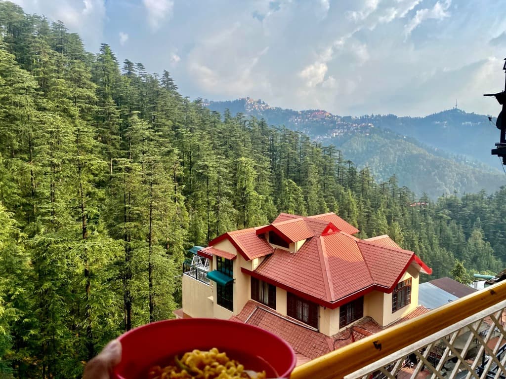 Hot vegetarian mountain meal on balcony overlooking Himalayan valley
