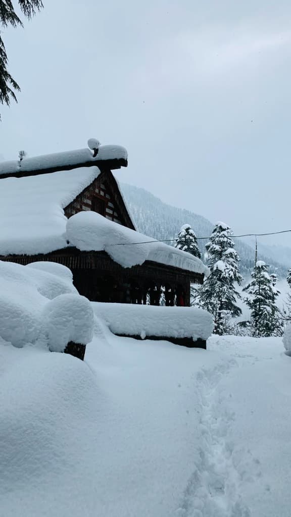 Dev Homestay Exterior in Winter Snow